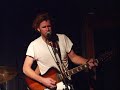 grayson performing with his band, the stumpknockers.