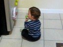 Playing by the fridge