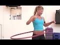 ACE's Jessica Matthews picks up a hula hoop for the first time with local hooping instructor Valentina 
