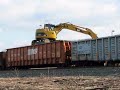 March 12, 2008: NS SD40-2 3430 blows the horn for the crossing as ties are being unloaded with a CAT grappler. 33A then comes east with NS Dash-8-40CW 8431, NS ES40DC 7506, NS SD38-2 3807, NS GP38-2 High Hood 5230, Conrail SW1001 NS 2110, and NS GP38-2 5637. NS GP38-2 5000 is on the rear and running, despite the previous problems. Nice engine noise, great horns, nice meet, and multiple views of machinery at work. Enjoy!