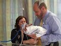 Rick and Ruth hold baby Sam Rick and Ruth hold baby Sam
