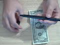 Pen through dollor revealed
