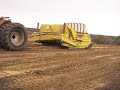K-Tec 3100 loading Sandy Soil with Roots K-Tec 3100 loading Sandy Soil with Roots