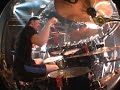 from behind the drums