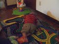 Caden playing on his playmat