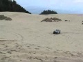 IH Scouts jumping at the sand dunes.