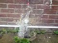 balloon bursting with water in slow motion