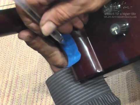 how to fasten acoustic guitar strap