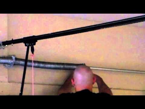 how to adjust springs on a garage door