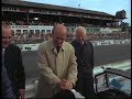 Jackie stewart shakes hands with juan manuel fangio