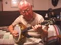jim robinson, 88 years old, practices on his 1931 gibson mastertone tb5, at a guest cottage in joplin, mo, in 2001