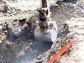 385 Cat Excavator Digging Solid Rock