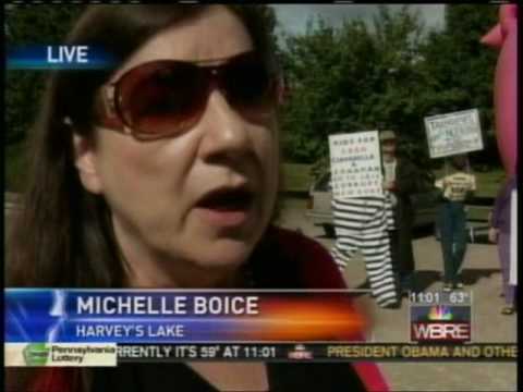 RCO64 - Protesters and a 25-foot pink pig of protest at the Luzerne County Courthouse in Wilkes-Barre, PA today (9/25/2009) for the 100th anniversary celebration. Th...
