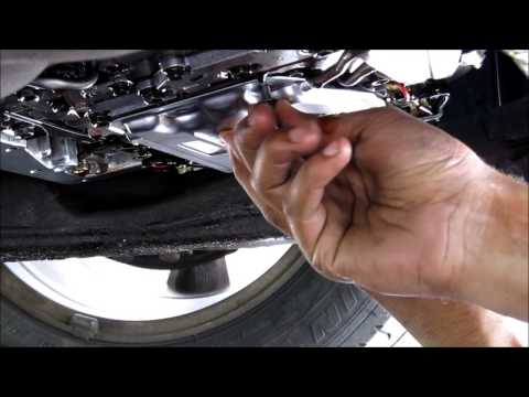 how to drain transmission fluid without dropping the pan