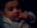 Adeen baby eating chicken both hands