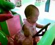 Elisha Otto (10 mths) rides with Barney