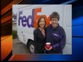 Dan Edwards and Pam Elliot, co-anchors of 2 News Sunrise, deliver a mug to another lucky winner.