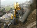 Menzi Muck A91 with powertilt and Normal Bucket on a steep hillside working in a vineyard