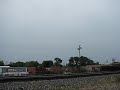 BN 2108 and BNSF 2605 hammer an eastbound baretable train through Lockport, IL. on 08/28/08. Really nice GP38/GP35u lash-up.