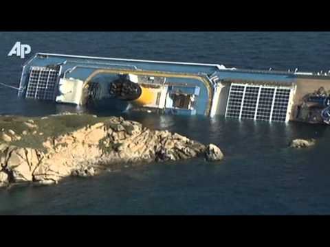 ship runs aground - Survivors from a luxury cruise ship that ran aground and tipped over, leaving at least three dead and 69 people still unaccounted for, described Saturday a c...
