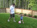 My daughter playing with a ball in the backyard