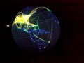 a cool dataset displayed on the noaa earth on a sphere showing global flight paths over a 24 hour period.