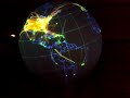 a cool dataset displayed on the noaa earth on a sphere showing global flight paths over a 24 hour period.