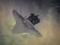 Space Shuttle Discovery performs a back-flip maneuver
