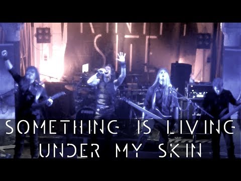 SOMETHING IS LIVING UNDER MY SKIN