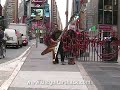 Dude Plays Giant Flying V Guitar in Times Square!