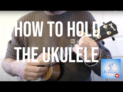 how to hold a ukulele properly
