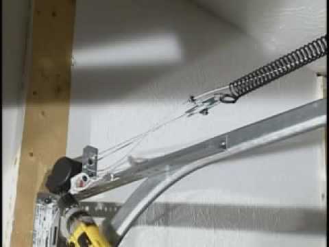 how to adjust springs on a garage door