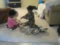Devin and Maya playing pots and lids