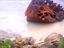 i took this video from the beach road area of tinian near the kammer beach.i'm standing near the area where you can see the wreckage of a wwii battleship.i pan the camera from the shipwreck swinging to the beachroad and on to kammer beach then slowly tilting downward to the boulders along the beach.its quite a good spot to take a picture from here cause you promote the beauty and serenity of this island tinian.and its history the rusty derelict gives us an impression that this place was once a staging area of the pacific war.hence we got the name of the place like `banzai cliff' and `suicide cliff' unquestionably saipan and tinian ,northern marianas.