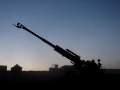 ARTILLERY FIRING AT DUSK IN AFGHANISTAN