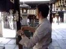 Osaka Hozenji Temple, buying Omikuji