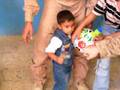 Marines pass out donated soccer balls to Iraqi kids
