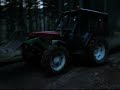 zetor 6945 is skiddind a tree