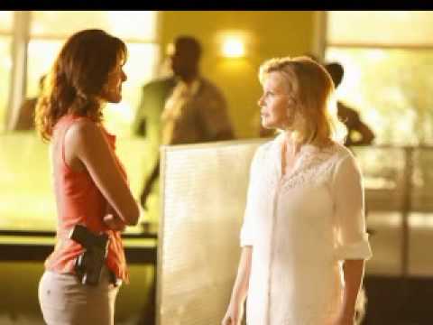 volleyball players in action. Three volleyball players