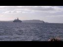 Yacht leading QE2 home to the Clyde for the last ever time