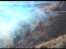 Fort Benton Fire - Firemen in Coulee using shovels