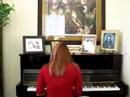 Vaneta tinkering with the piano on...