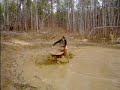 riding a 90cc four wheeler in the mud pit riding a 90cc four wheeler in the mud pit