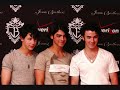 in the car with kevin and nick

nicks p.o.v.
i wonder chelsea has ever been to one of our concerts. she didn't seem like a crazed fan. maybye she can come with us on tour. does 
she have a boyfriend? whoah! nick first your thinking about taking her on a date! now tour! and then if she has a boyfriend! shouldn't
you be thinking about how you're should take lola on tour? do i like chelsea? no you don't cause i like lola. right? right?


at the mall with mawra and chelsea.
chelsea: uhh! this mall has no good stores! i wouldn't be caught dead in a deparment store. [thinks of something] hey mars wanna go to new york barneys is having a sale!
mawra: ok! what's-
chelsea: a store!
mawra: oh
they got on the cockney family private jet and flew to new york. a close to the end into thier 12 hour flight...
mawra's cell phone rings.
mawra: hello?
nick: hey mawra can i talk to chelsea?
mawra: sure!
hands the phone to chelsea.
chelsea: hello?
nick: hey!
chelsea's face brighted
chelsea: so wacha doin?
nick: trying to calm kevin down where are you guys?!?!?
chelsea: private jet.
nick: what!?!?!
chelsea: i said private jet!!
nick: i know what you said. why are you on a private jet?
chelsea: oh! i'm going to barney's! big sale!
nick: isn't that in new york!
chelsea: yea that's the one!
nick: well chelsea, can you tell me why your going on a twelve hour filght to new york!?!?!?!?!
chelsea: well your mall sucked! it was all macy's and jcpenny's! not one jimmy choo's heels in sight!
nick: so you flew to new york!!!!
chelsea: well duh were going to get dresses from barney's 5% off! big sale! duh!
nick: well me and kevin are flying down their right now!
chelsea: ok see ya then were getting ready to land it's 12 o' clock her so see you at 11! should we stay over night?
nick: yea i guess.
chelsea: alright i'll book us 2 rooms at the trump hotel! one for girls! one for boys! were landing so i gotta go bye!
nick: but- uh.

with kevin and nick
nick: c'mon kevin were going to new york
kevin: why?
nick: cause thats were chelsea and mawra are.
kevin: what!?!
nick there going to barney's you know the one on the upper east side.
[a.n. anyone watch gossip girl?!?!]
kevin: why!?!
nick: sale.
kevin: oh.
nick: yah. c'mon let's go to the airport.
kevin: ok 

with chelsea and mawra.
chelsea: were here!
mawra: wow! this place is amazing!
chelsea: just wait 'till you see the shopping!
they walked over to barney's
chelsea: let's shop till we drop!
they wen't and shopped and shopped.
chelsea: alright i found two dresses. what did you find mawra?
mawra: nothing.
chelsea: well i'll help you!
they ended up buying two matching black formal dresses with a white bow tied around them. for a last minute wedding or something. and one formal dress each. chelsea's was a sequined form fitting blue dress. and mawra's was a little black dress.
[a.n. all of them in the video] 
chelsea: do you wan't to go to our hotel? 
mawra: sure.
[they walk to there hotel check in blah blah blah. finnally they get to they're hotel room.
c/m: oh. my. god.
the room had a fountian in the middle of it and two king size bed by th fountain under the pillow was a peice of choclate imported from belgum [sp?]
to the right was a spacious kitchen with granite counter tops and to the left was a lounge with and in-ground hot tub [a.n. do they exist? idk.]
and a plasma screen tv with two recliners. there was an office off the left side. with an huge apple computer!
mawra: it's it's...
chelsea: goregeous!
mawra: yea that.
chelsea: do you wanna try on our dresses and do a photoshoot or something!?!
mawra: ok! but we need a camera!
chelsea: nikon store next door!
mawra: well c'mon!
they go across the street and buy two nikon d700's
cashier: that'll be $1875
chelsea: charge it!
back at the hotel
chelsea was holding the camera and taking pictures of mawra
chelsea: last shot! one two three!
mawra had shot 300 shots but to her it felt like 5 she was having so much fun!
mawra: yay! my turn to be behind the lens!
chelsea: ok let's do mine by the fountain.
mawra: yes. 
400 shots later.
chelsea: how about we do one of both of us in our diffrent dresses and then the matching ones.
mawra: ok! but the camera.
chelsea: here one sec! [runs to the camera sets it to that one thing were it takes the picture for you][runs back] ok smile in 3, 2, 1! go!
just then nick and kevin walk in.
n/k: wow!
mawra: us or the hotel?
chelsea: us. cause you know we look hot!
after she said that the whole room erupted into a fit of laughter.
[alright i'm skipping time it's like one a.m. and the groups watching the grudge]
chelsea falls asleep on nicks shoulder and nick gets kinda sleepy too so he falls asleep ontop of chelsea's head.
mawra: aww look at that.
kevin: aww!

the end for now will nola or lick last forever!!! or will will there be a nelsea or a chick going on!?!?! who know's!?!?! i do!!!!!! bye
-peacelovejonas1000