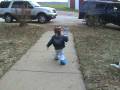 Oliver mowing with his cookie monster shoes on.mpg