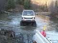 Kei Truck with tracks crossing creek