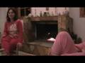 Playing guitar ,singing Greek songs next to the Fireplace