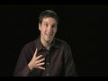 about 3 minutes worth of video clips relating to the discovery of the active galaxy 3c321. 

first clip (46 seconds, no audio)-
'this animation of 3c321 begins with a close-up of the supermassive black hole in the center of the main galaxy. hot gas is falling towards the black hole via a blue disk. some of this material is swallowed by the black hole, but much of it is ejected in a narrow jet of particles traveling at almost the speed of light. the camera then pulls back to show stars and a dust lane in the main galaxy. as the field of view continues to increase in size, the companion galaxy becomes visible as it swings into the path of the jet from the main galaxy. the jet is deflected and disrupted by the impact with the companion galaxy.'

clips 2, 3, 4 and 5 (1:40 seconds)-
'in these segments, dr. daniel evans of the harvard-smithsonian center for astrophysics discusses the 3c321 result and its significance. dr. evans and his collaborators made the discovery by combining information from both space-based nasa missions as well as radio observations from the ground.'

clip 6 (23 seconds, no audio)-
'this series of images shows how 3c321 looks in a variety of types of radiation. beginning with a wide-field view of x-ray and radio emission, the image reveals jets that extend for about 1.7 million light years before zooming into the central two galaxies. optical and ultraviolet data from hubble, radio emission from the very large array and merlin, and x-rays from chandra combine to reveal how the jet from the main galaxy on the lower left is striking its companion galaxy to the upper right. the jet impacts the companion galaxy at its edge and is then disrupted and deflected, much like how a stream of water from a hose will splay out after hitting a wall at an angle.'

clip 7 (14 seconds, no audio)-
'this sequence compares the composite image of 3c321 to an artist's illustration of the system, showing the main galaxy and the companion galaxy. a jet of particles generated by a supermassive black hole at the center of the main galaxy is striking the companion galaxy. the jet is disrupted and deflected by this impact. the key features of this system are labeled in the final view.'

source- http://chandra.harvard.edu/photo/2007/3c321/animations.html more info- http://chandra.harvard.edu/photo/2007/3c321