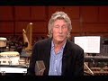pink floyd's induction into the uk music hall of fame. only david and nick are present. roger accepts the award via satellite, and rick is absent due to surgery.