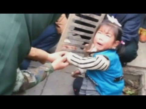 Child in China gets stuck: Girl gets hand stuck in a drain
